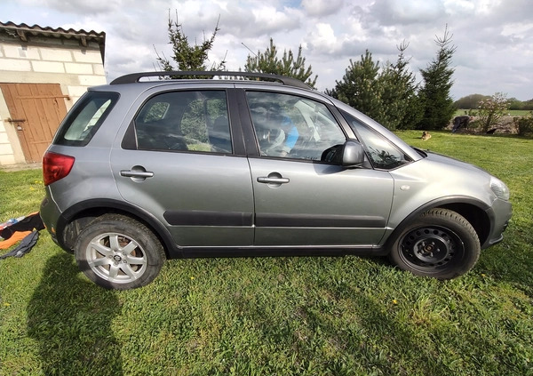 Suzuki SX4 cena 34500 przebieg: 135140, rok produkcji 2013 z Szczecinek małe 211